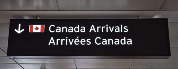 Immigrate to Canada. Canada arrivals sign post